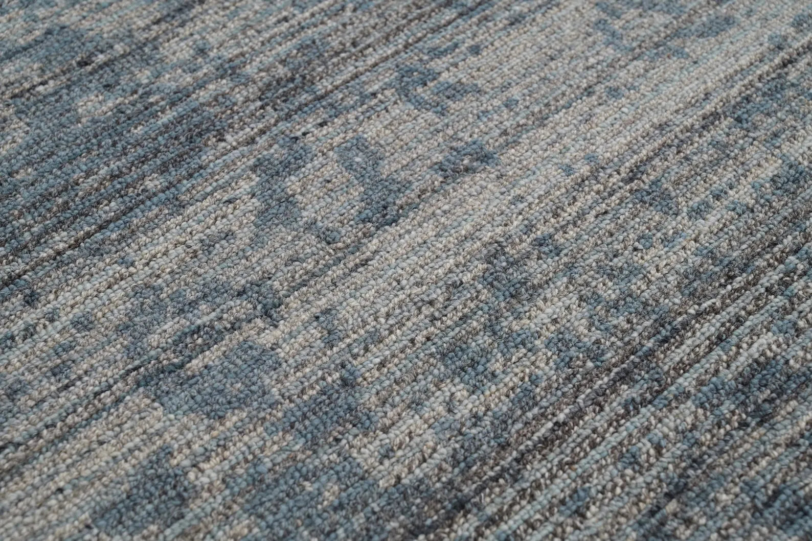 Azure Fade Rug closeup view showing intricate faded blue pattern and fine woven texture