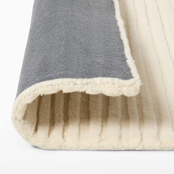 Back And Side angle of Ivory Rhythm Rug highlighting linear texture