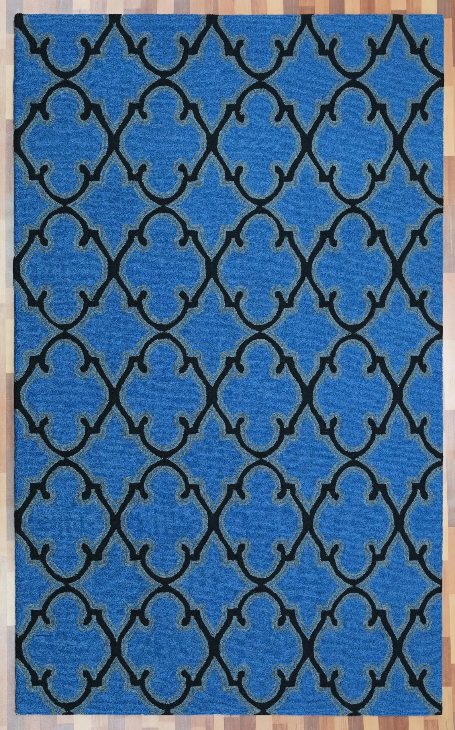 Full top view of Bluenox Rug showcasing its complete blue surface with elegant black trellis pattern and even hand-tufted texture.