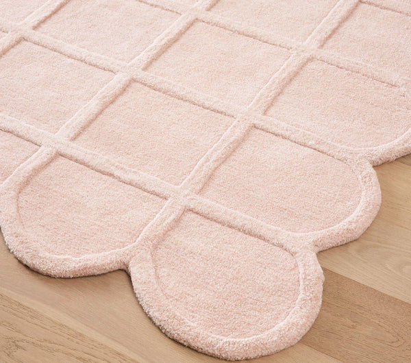 Corner detail of cream Blush Quilt Rug showing rounded edges and soft tactile texture.