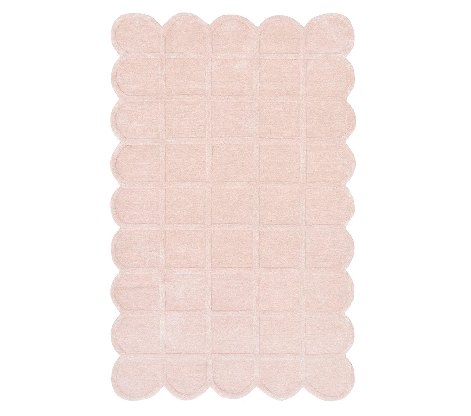 Full top view of the Blush Quilt Rug in soft pastel pink featuring scalloped edges, quilted grid pattern, and plush hand-tufted texture on a white background for a cozy and elegant appeal.