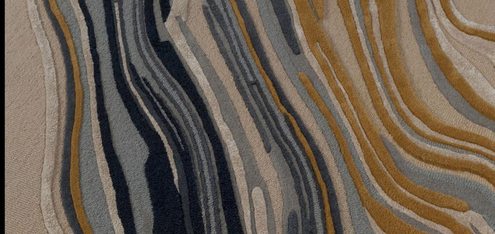 Bold Designer Swirl Carpet styled with dramatic dark and golden accents