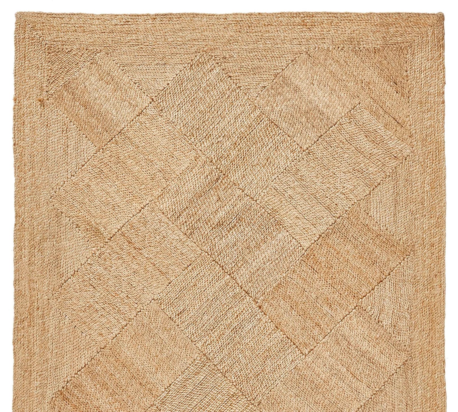 Top view of Cascara Rug highlighting its natural beige tone and symmetrical woven pattern.