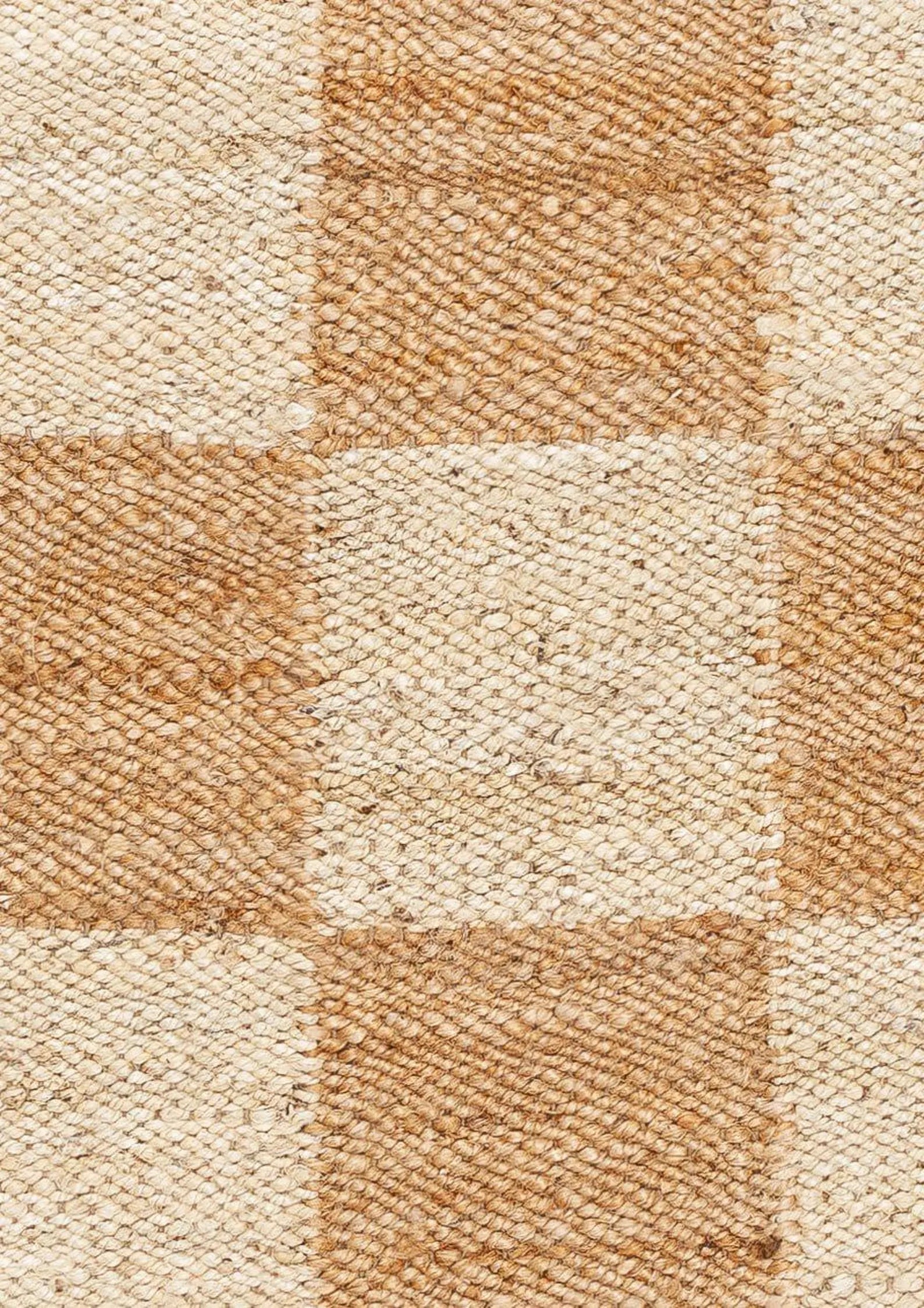 Close-up of Chesson Rug highlighting its tightly woven jute texture and detailed checkerboard pattern in beige and ivory tones.