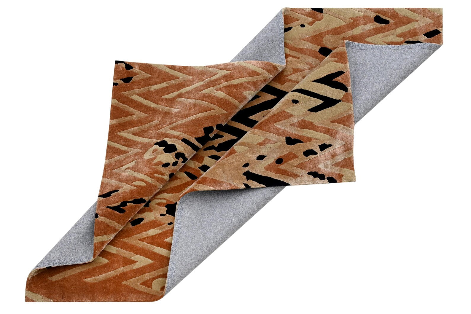 Side-folded view of Chevron Distorted Rug emphasizing texture, thickness, and color variation across the pattern.