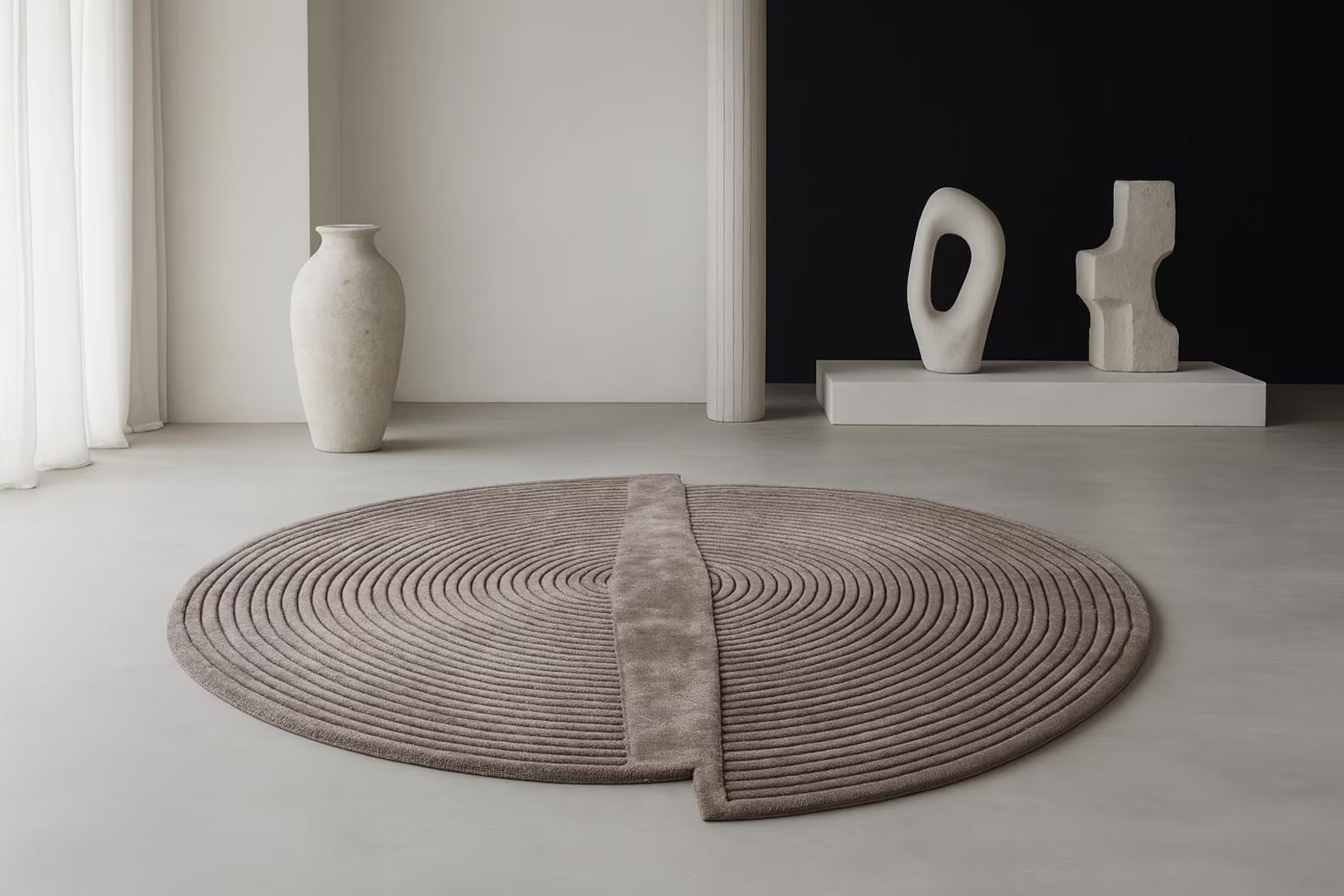 Circular Ribbed Rug styled in a modern interior with sculptural décor.
