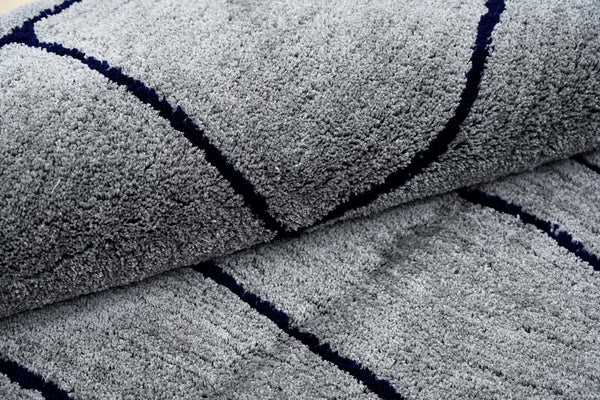 Close up view of abstract  grey rug 