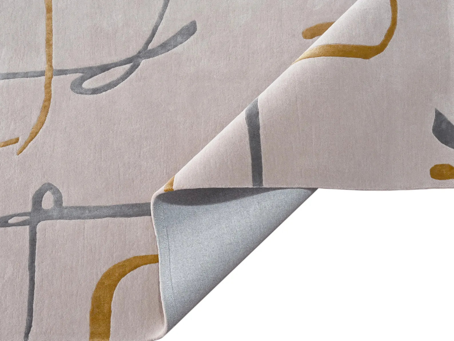 Fold detail of Contour Thread Rug showing premium hand tufted surface and precise edge finishing