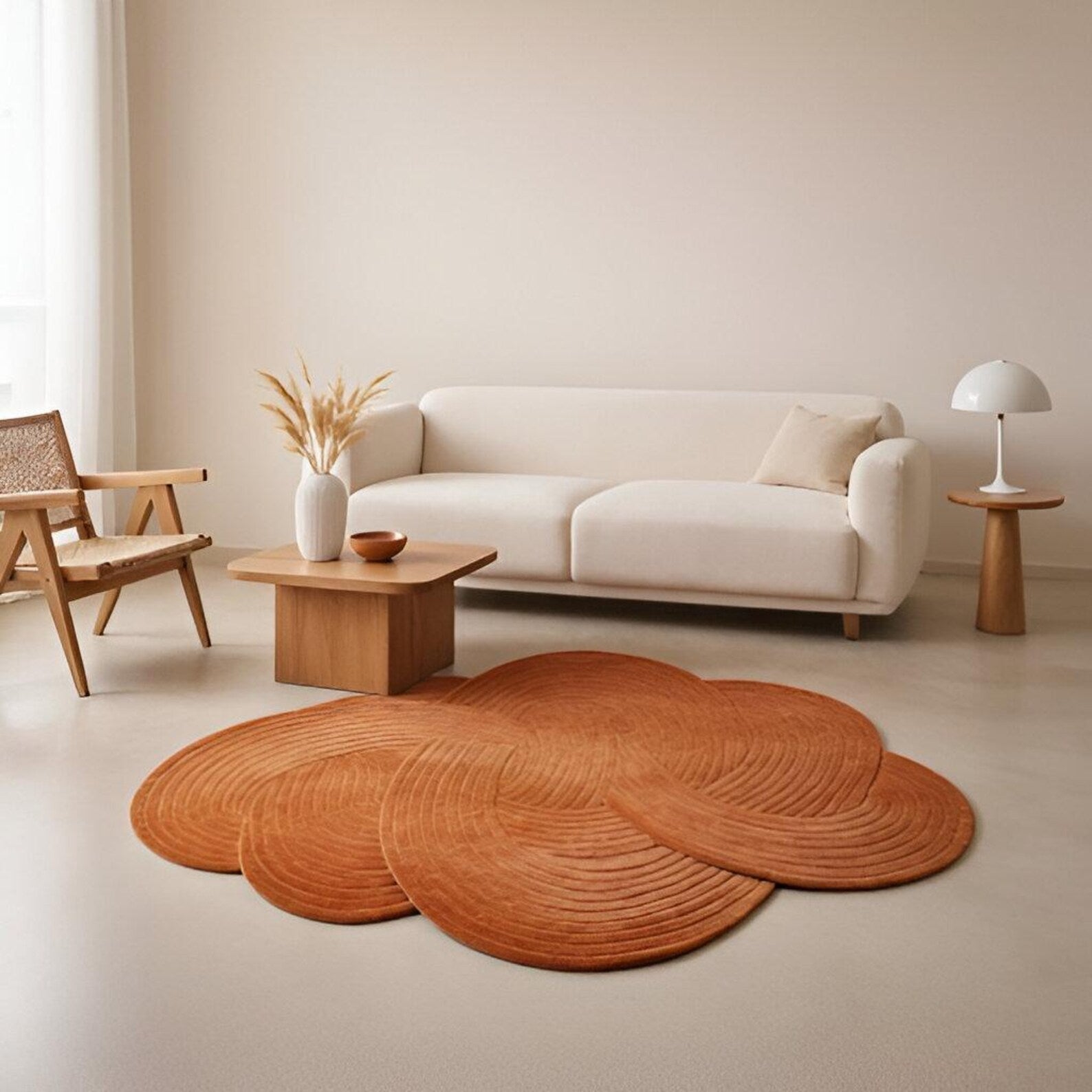 Living room styled with Desert Wool Rug in terracotta under sofa and wooden table.