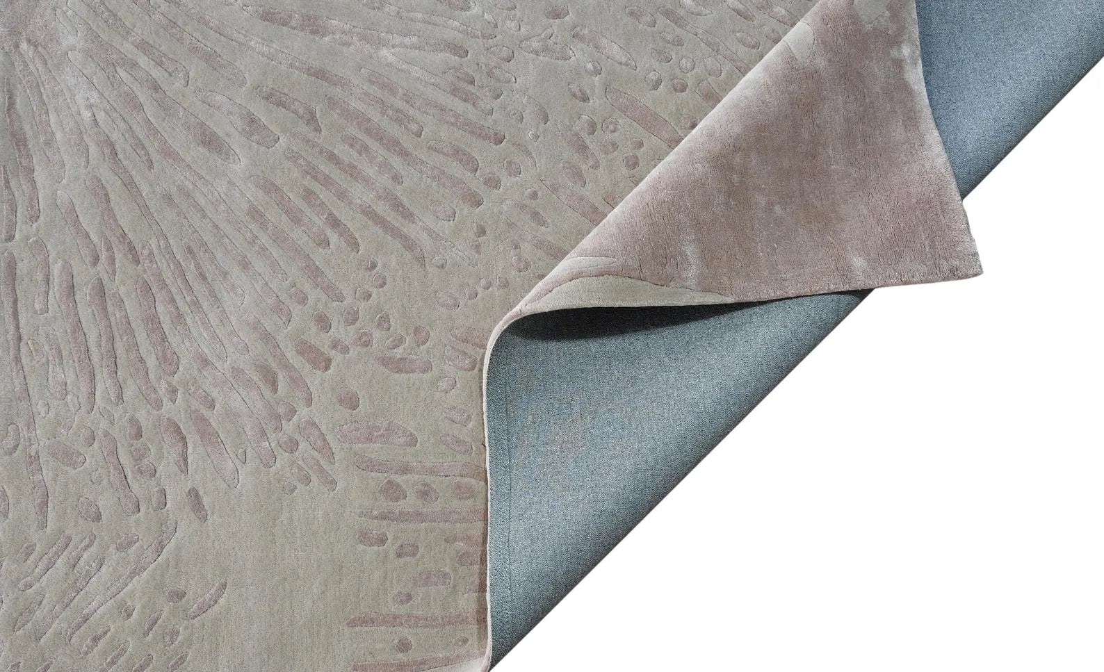 Side corner folded contemporary Dune Rug styled in a modern living room