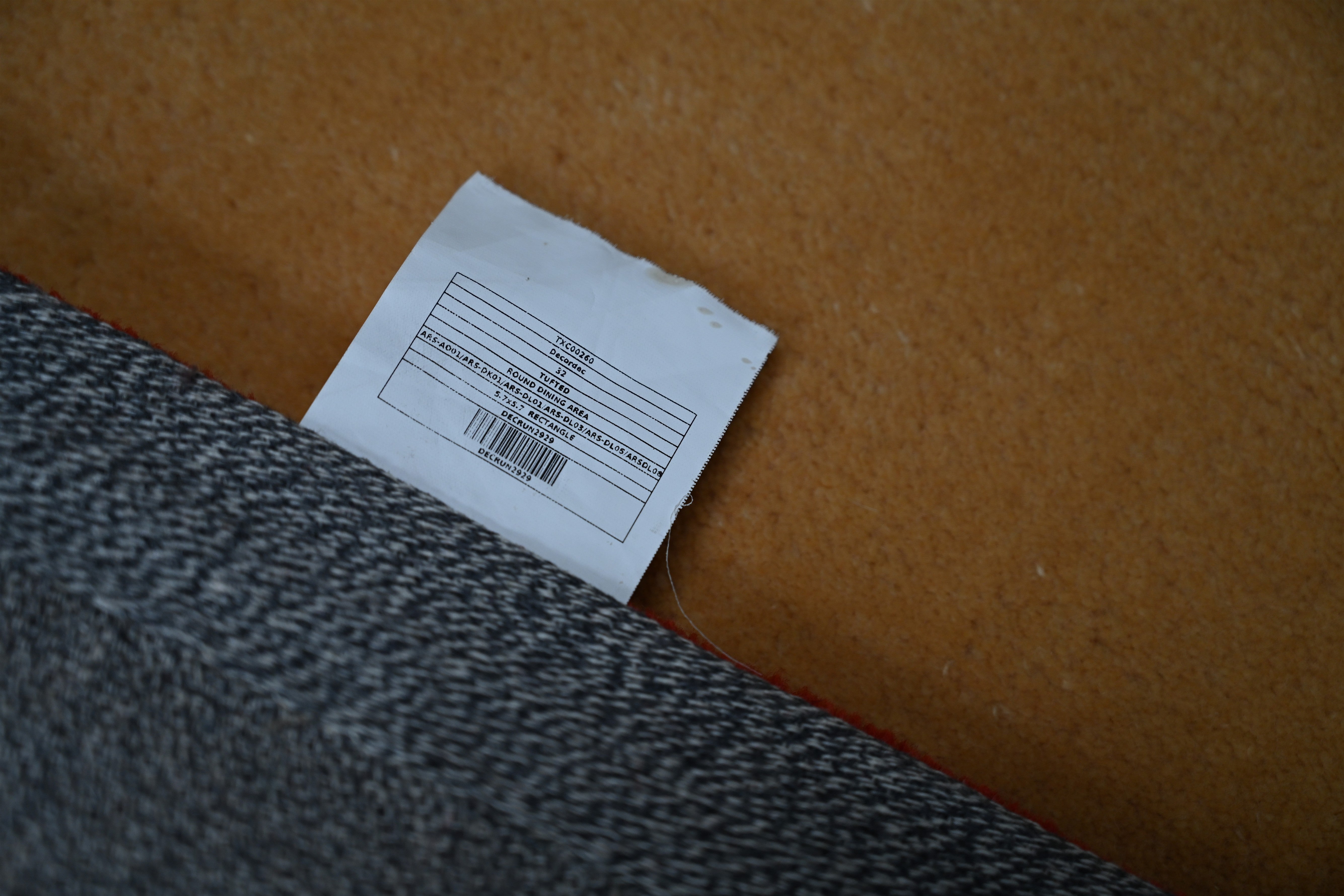 Close-up of Eternal Colors Rug backing showing quality finishing.
