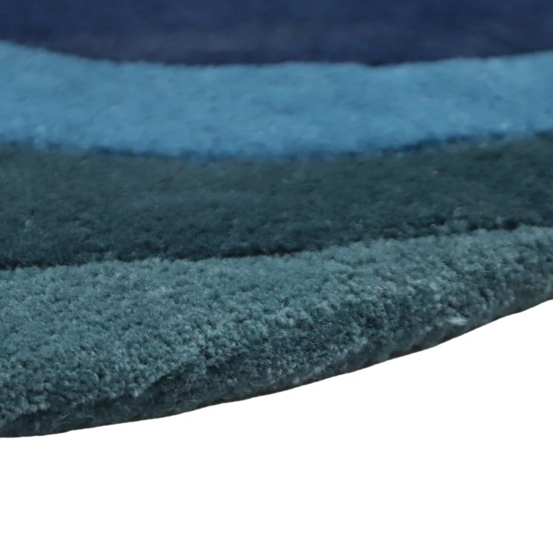 Close-up of Eternal Trellis Rug in layered blue tones.