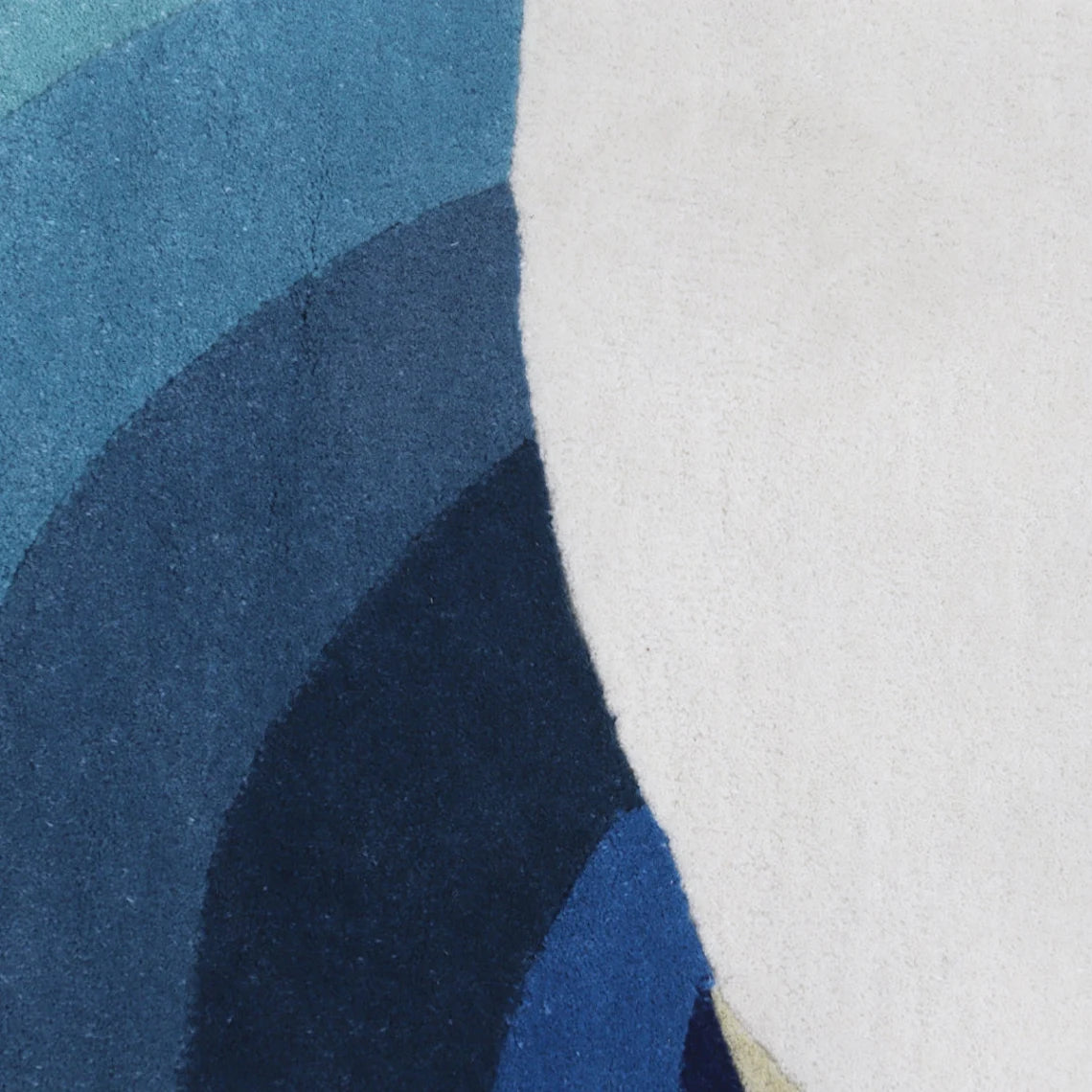 Close-up of Eternal Trellis Rug in layered blue tones.