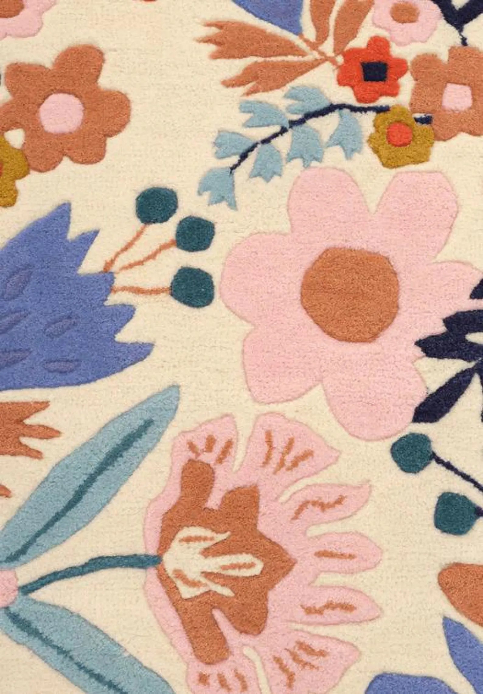 Floryn Rug side angle view showing balanced floral placement and beige border edges.