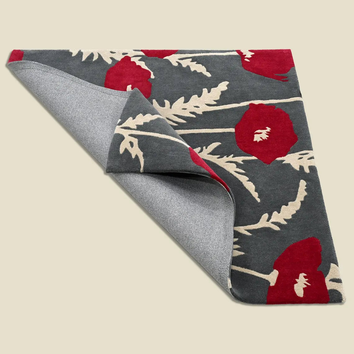 Folded edge view showing soft pile and handmade finish.