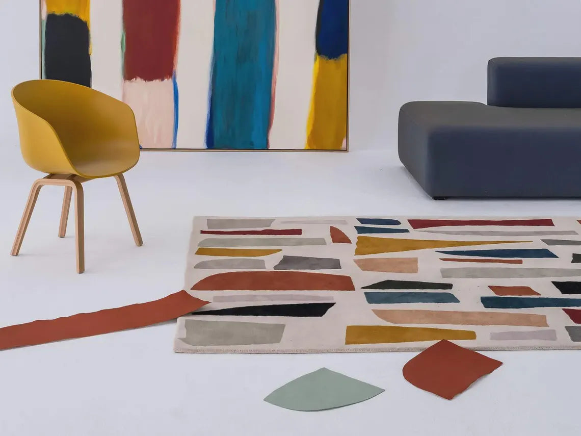 Abstract Fragment Rug styled with a yellow chair, highlighting bold color blocks