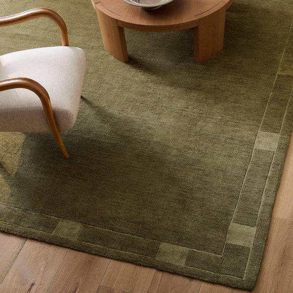 Framefield Rug styled in a modern living room with earthy tones and defined borders.