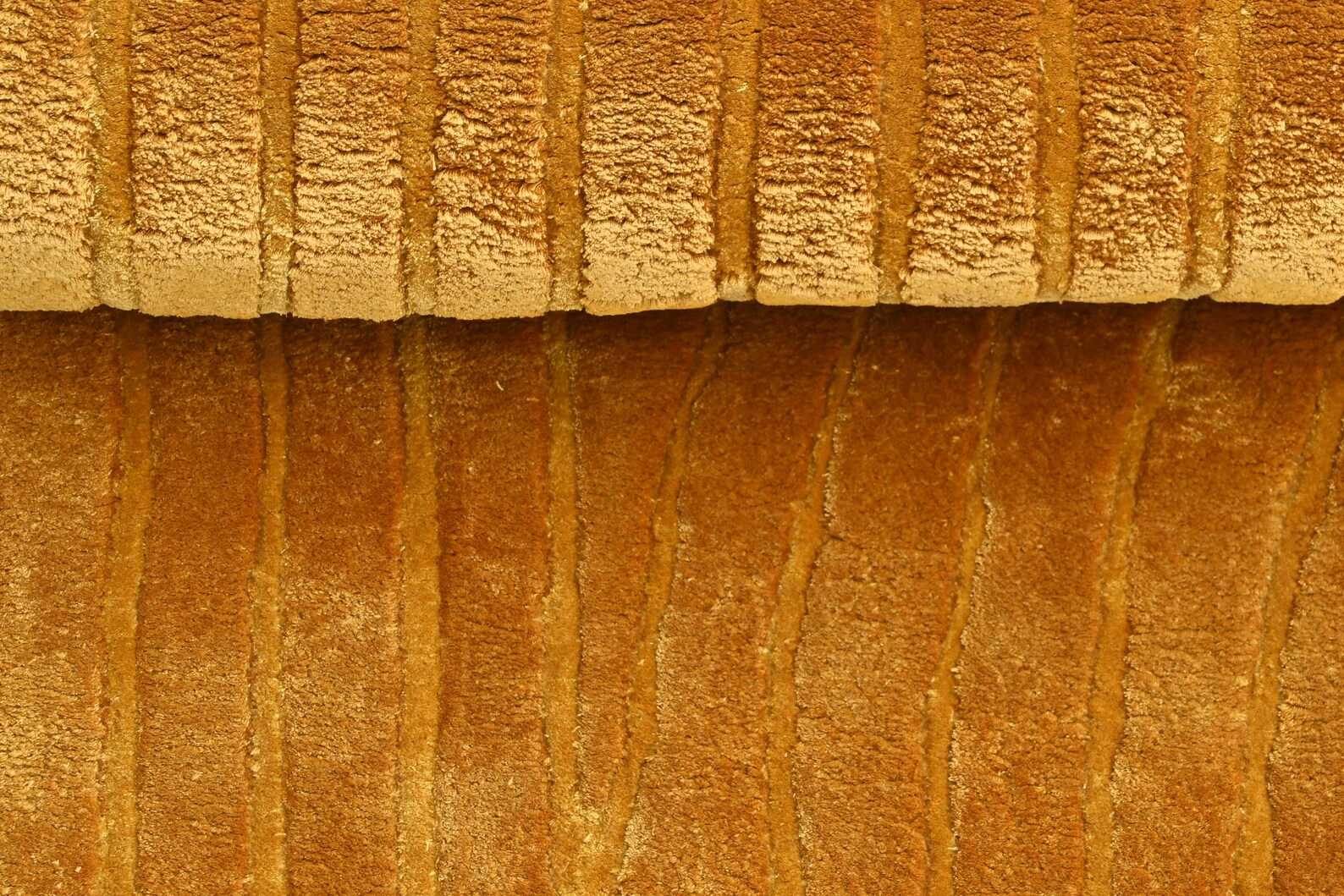 Close view Walkin Wardrobe Rug in golden yellow with ribbed velvet-like texture.