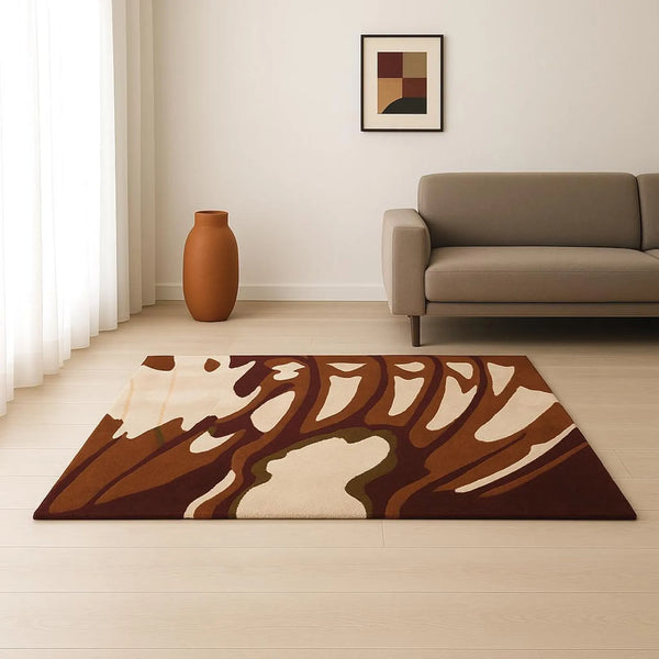 Hazel Rug styled in a modern living room with cream walls and minimal furniture, showcasing its organic brown and beige abstract pattern.