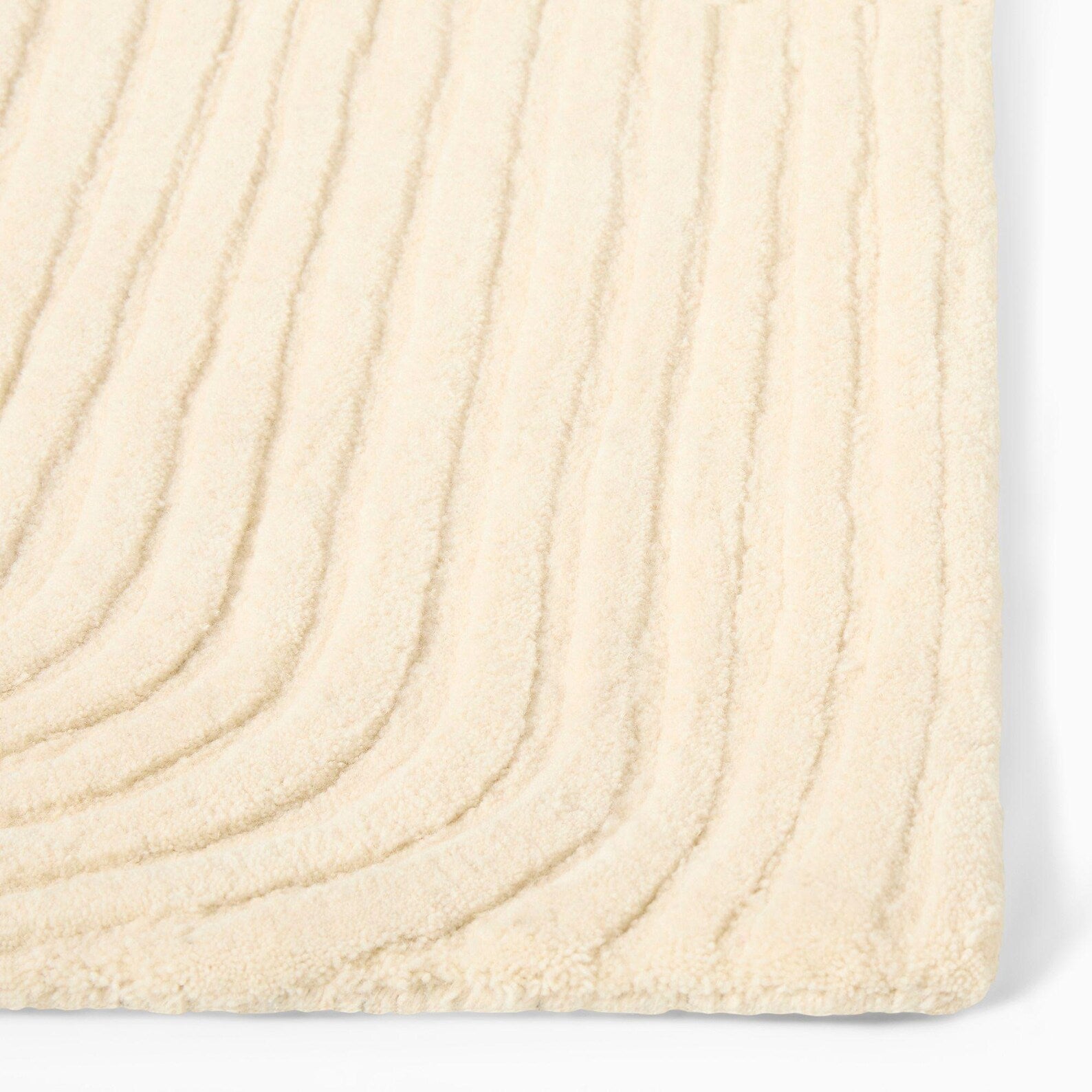 Side angle of Ivory Rhythm Rug highlighting linear texture.