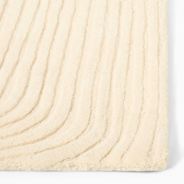 Side angle of Ivory Rhythm Rug highlighting linear texture.