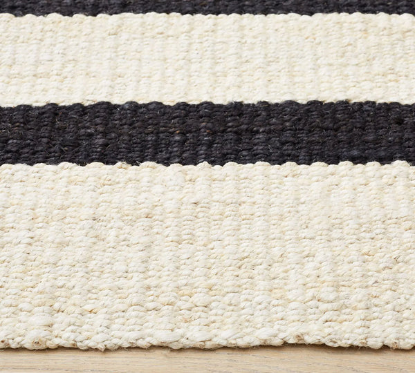 Loomtrail Rug variant featuring bold black stripes on ivory background with textured handwoven appeal.