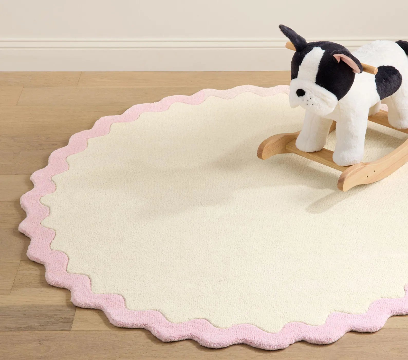 Lullaby hand tufted Rug alternate border version with blue scalloped trim for soft pastel room settings
