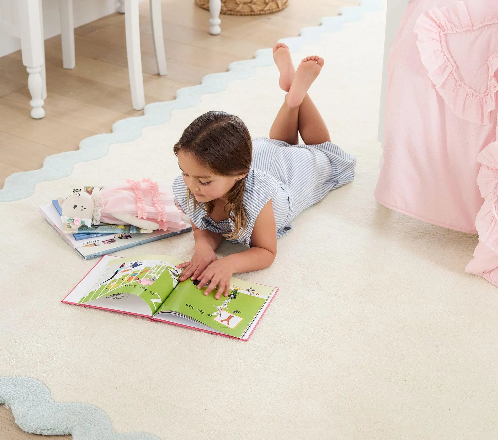 Lullaby hand tufted Rug styled in a cozy kids room with toys and natural light creating a peaceful atmosphere
