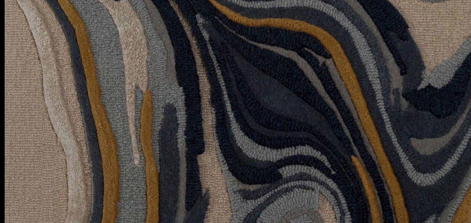 Midnight Marble Swirl Rug close-up showing flowing deep blue, gray, and mustard lines
