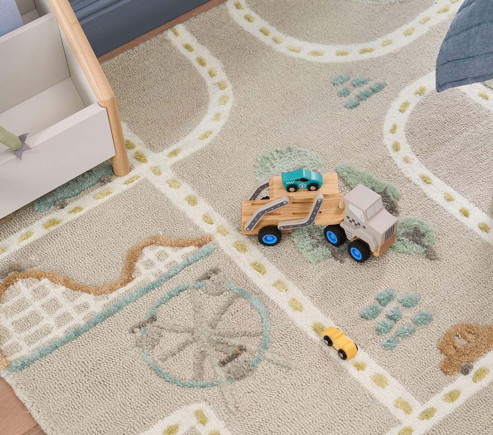 MiniCity hand_tufted_rug placed in a bright kids’ room setup with toys and furniture, creating an inviting play environment.