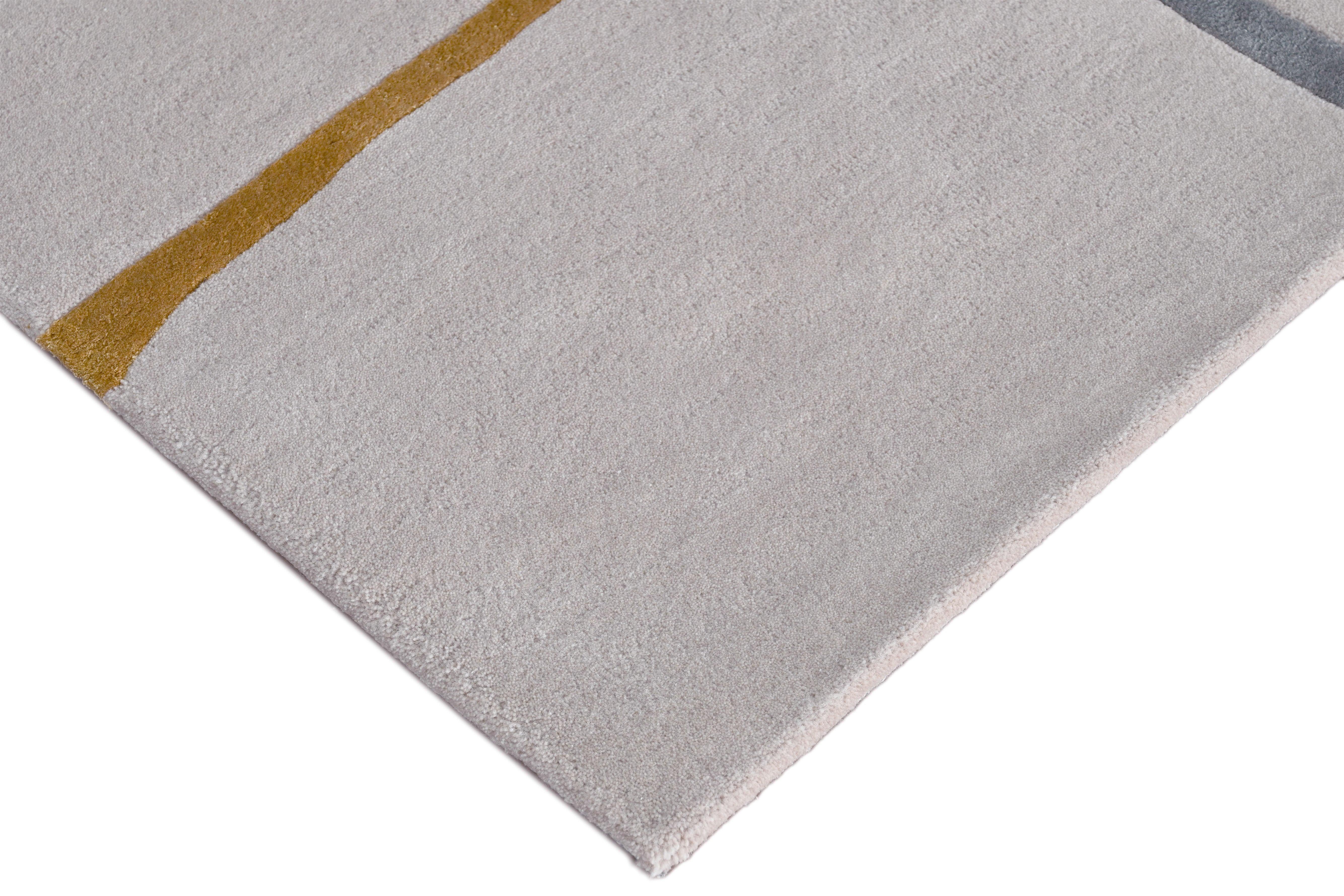 up of Muted Motion Rug edge highlighting clean finishing and tufted design.