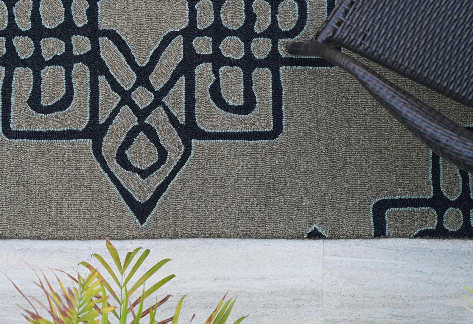 Close-up of Navier Rug showing navy geometric pattern on grey textured base.