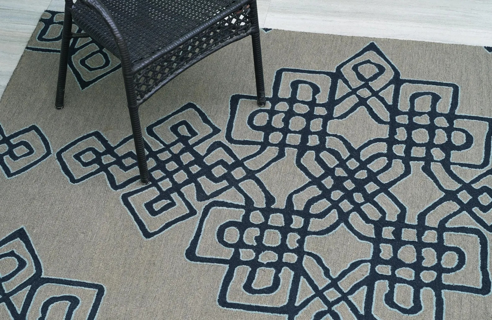 Nexform Rug full view showing navy geometric pattern on soft grey background