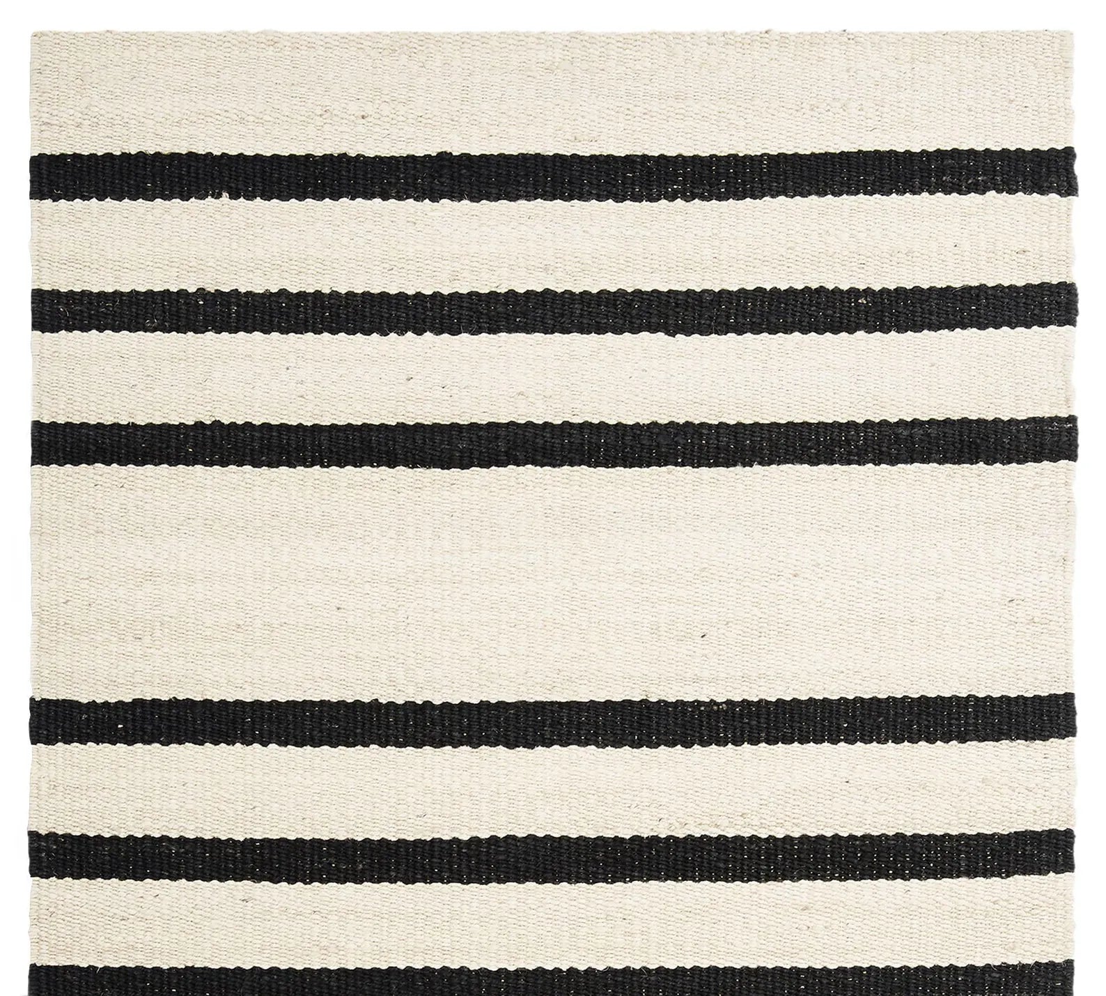 Noirpath Rug full top view on white background showcasing handwoven black horizontal stripes on an ivory base.