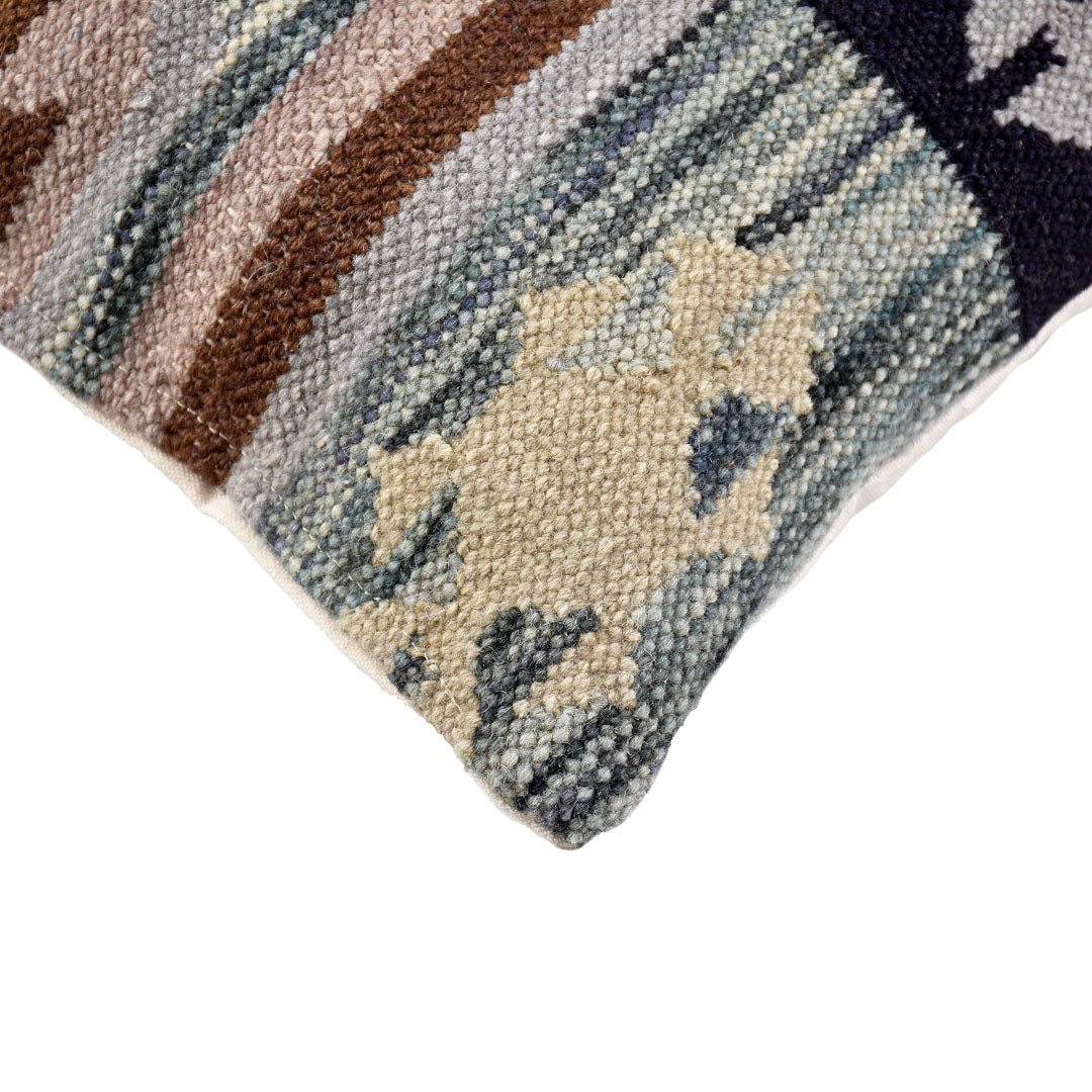 Close-up of the Nordic Tribal flatweave wool pillow showing detailed weave and tribal pattern.