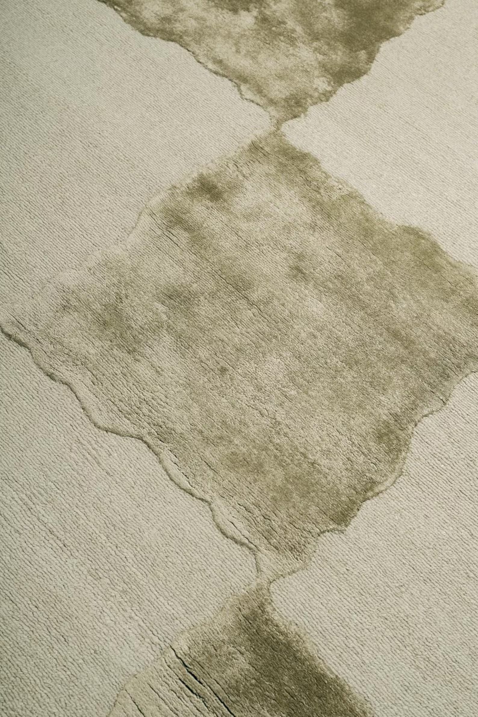 Grid pattern detail in muted green and beige tones.