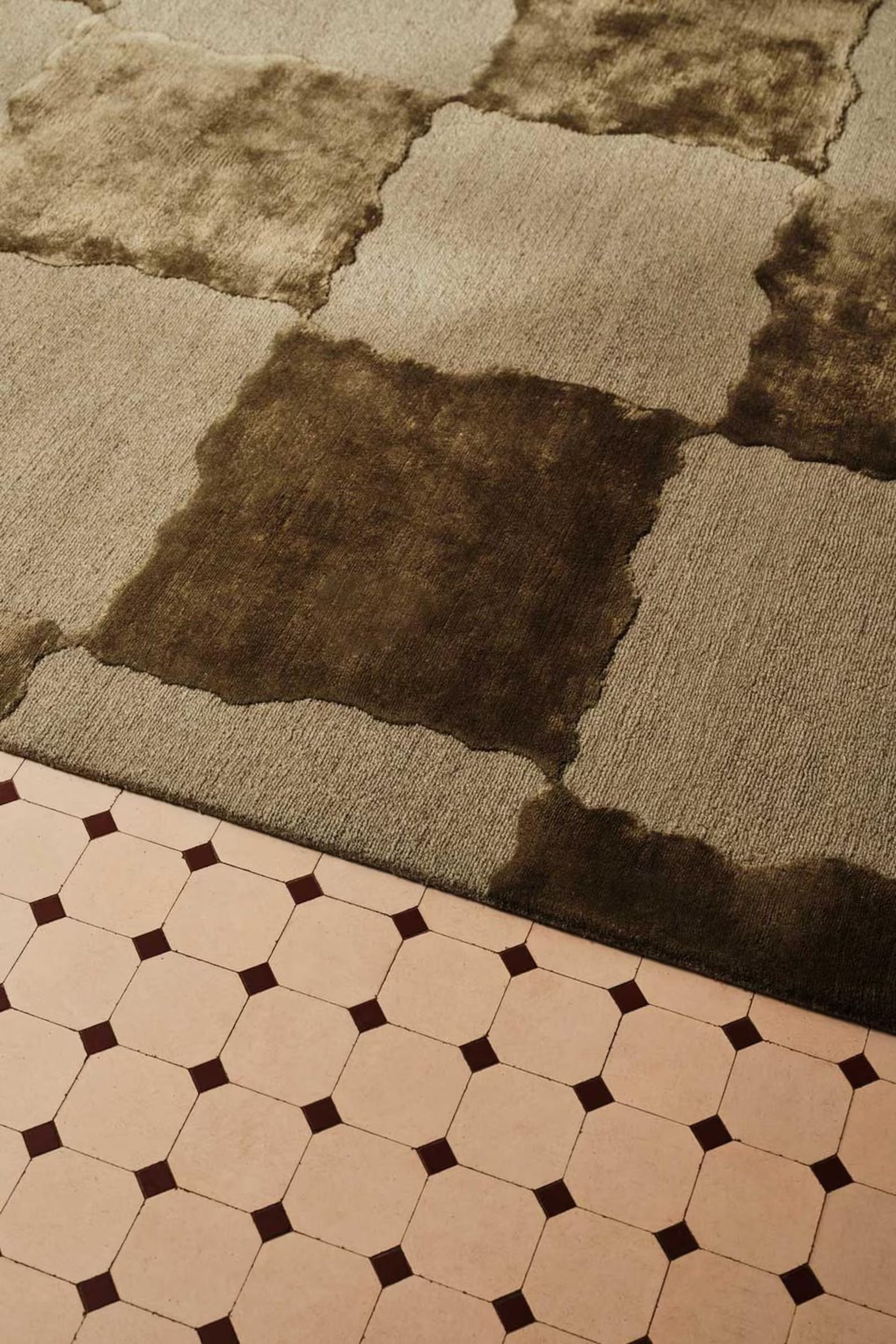 Rug placed with rustic chair highlighting earthy checks.