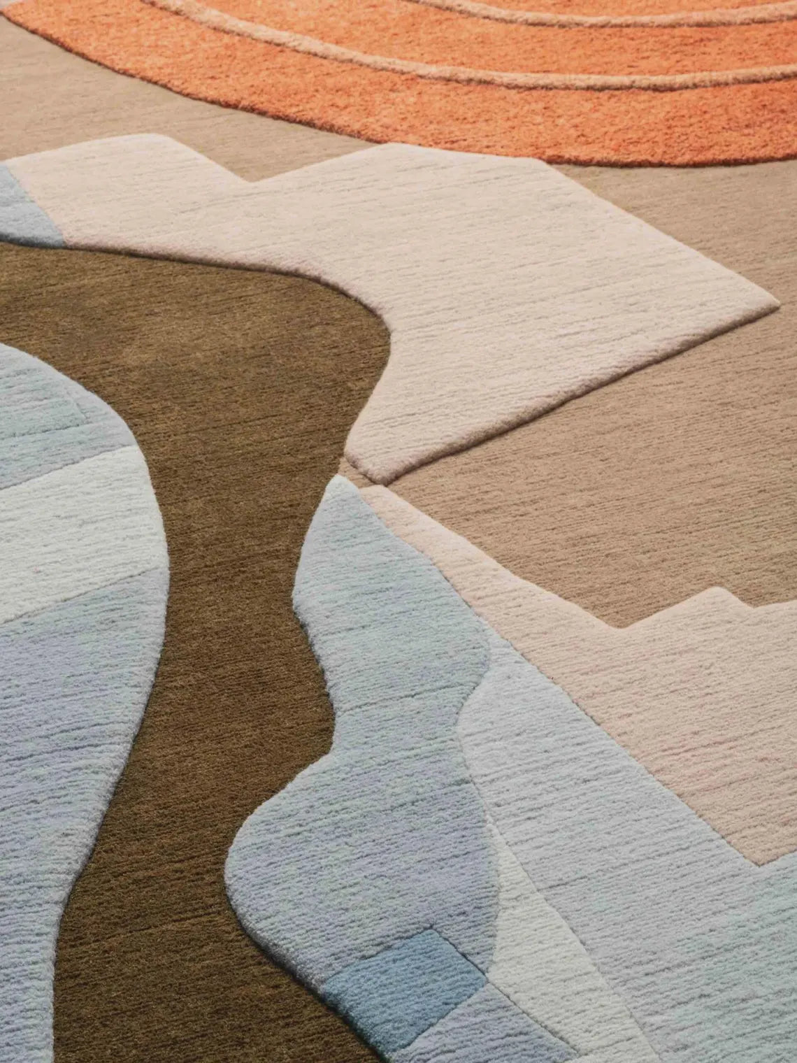 Side angle of Petra Rug highlighting layered earth-inspired patterns.