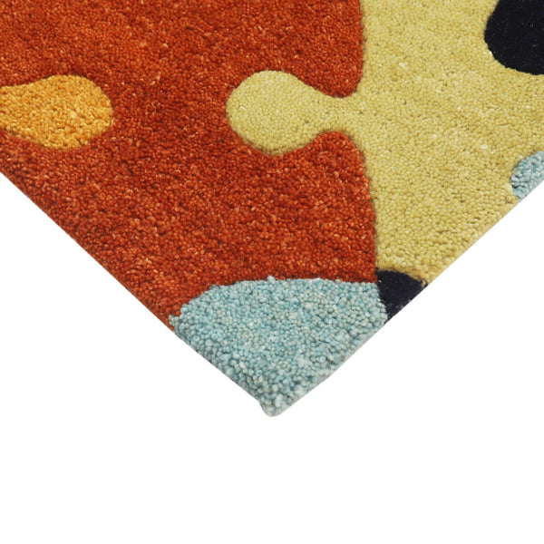Corner detail of Playgrid Rug showing seamless finishing and colorful puzzle motifs.