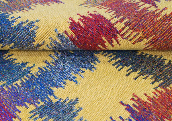lose-up of Radiance Flow Rug showing multicolor abstract weave on a yellow base.