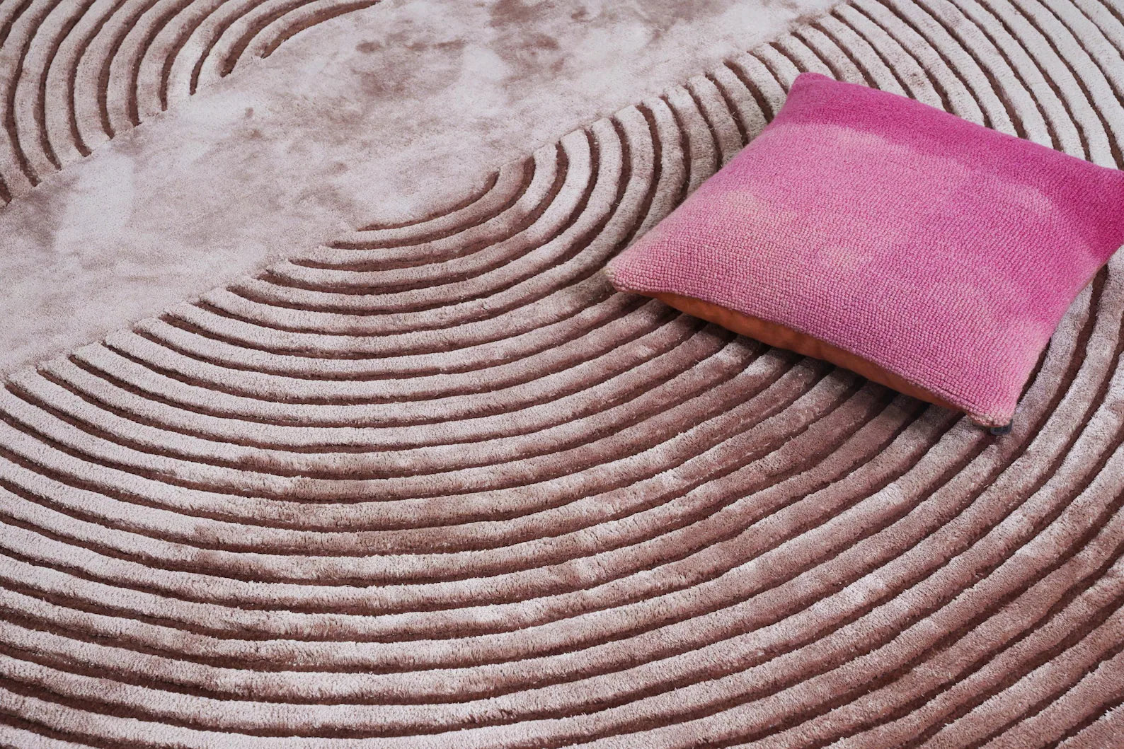 Designer Circular Ribbed Rug styled with books and a cushion