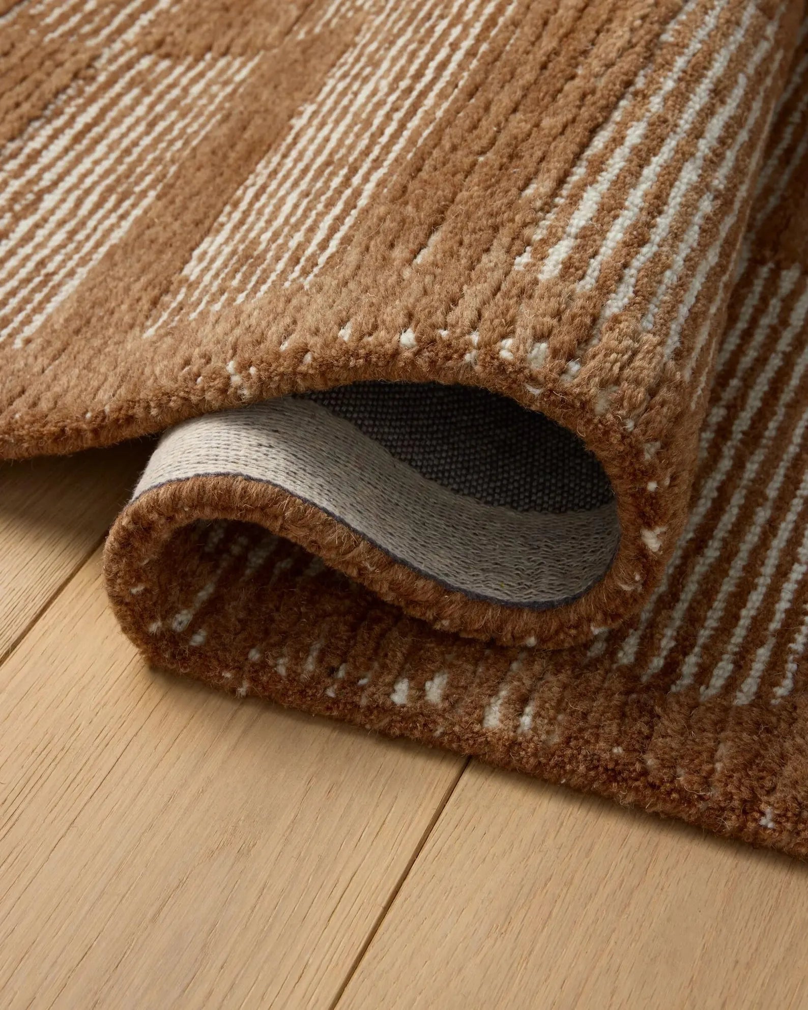Close-up of Rustic Checkered Rug showing hand tufted checkered texture.
