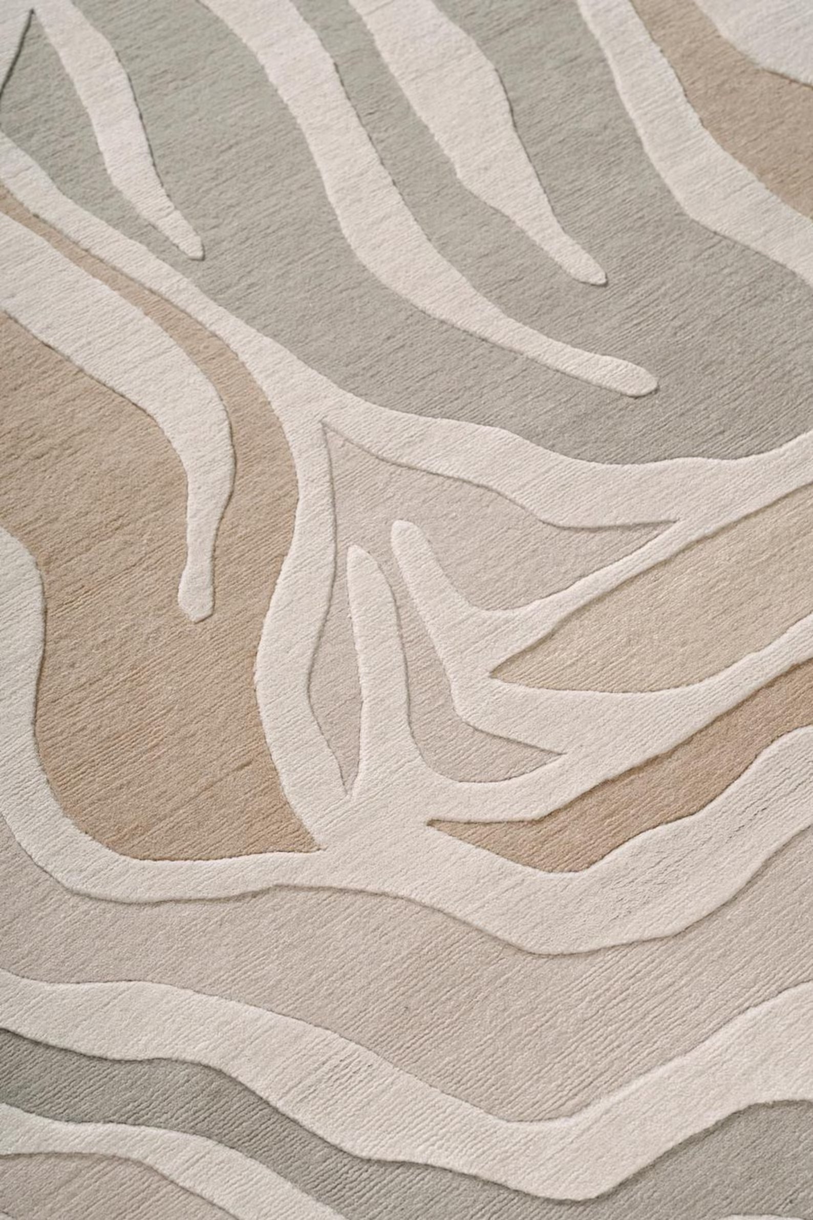 Sandstone Swirl area rug styled in modern living room interior with abstract wavy design – Decordec