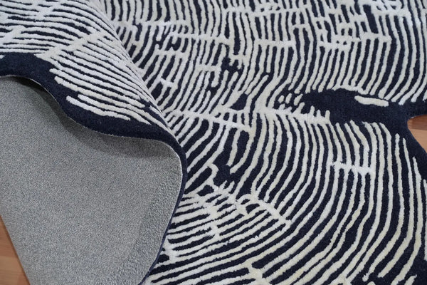 Sequoia Rug folded at the corner to display its durable wool backing and soft high-low texture detailing.