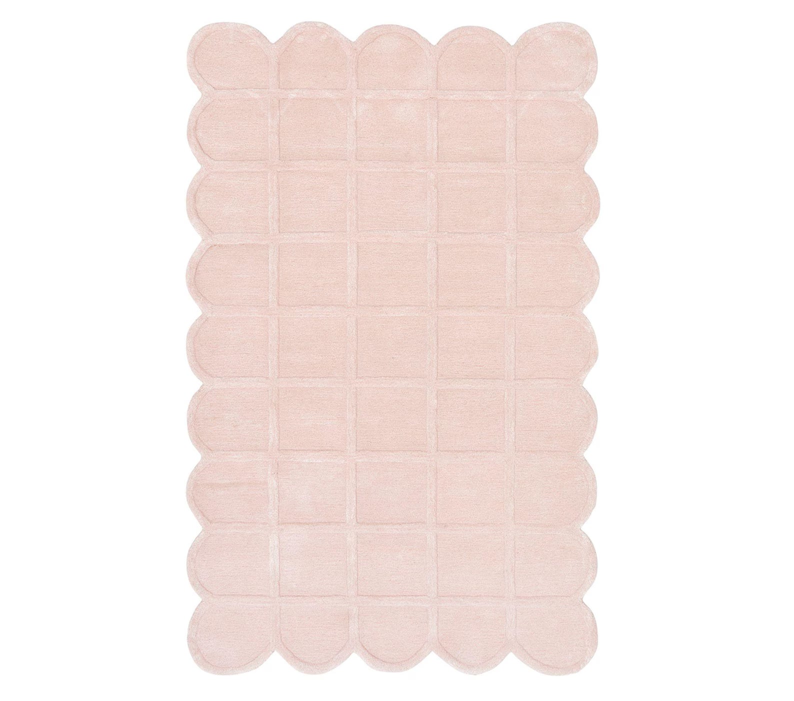 Full top view of the Seraphine Petal Rug displaying its scalloped edges, uniform blush pink color, and grid pattern texture against a clean white background.