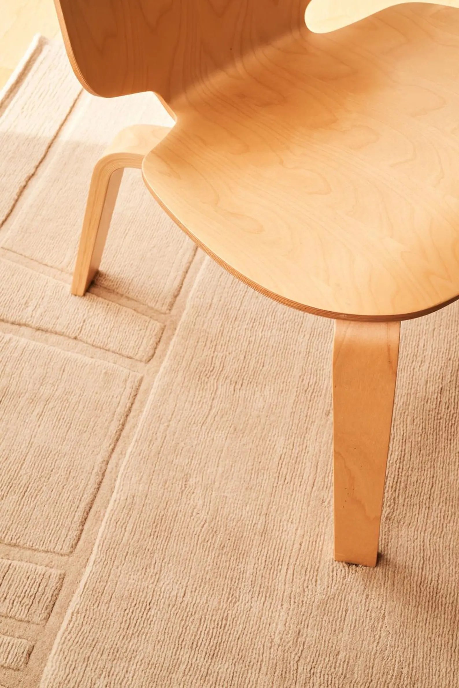 Script Rug closeup view showing fine line detailing and textured geometric surface