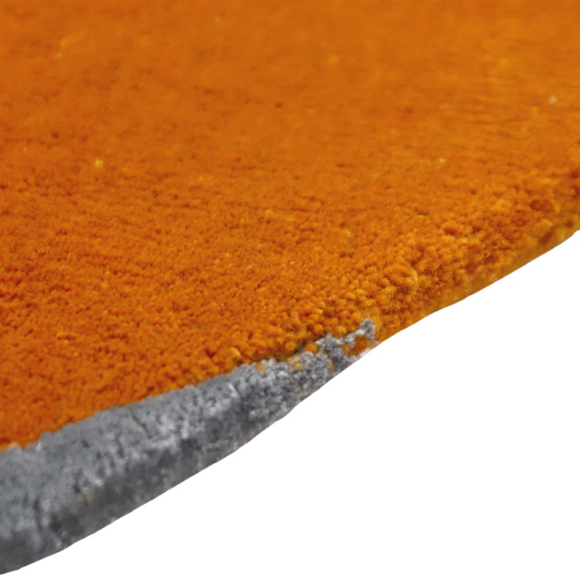 Side angle of hand tufted Solar Eclipse Rug showing thickness and detail.