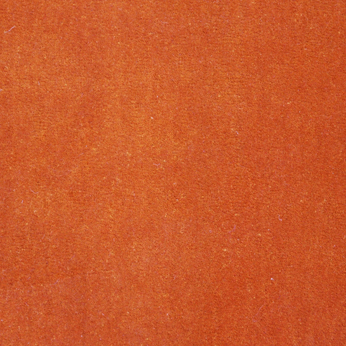 Hand tufted texture close-up of Solar Eclipse Rug in vibrant tones.