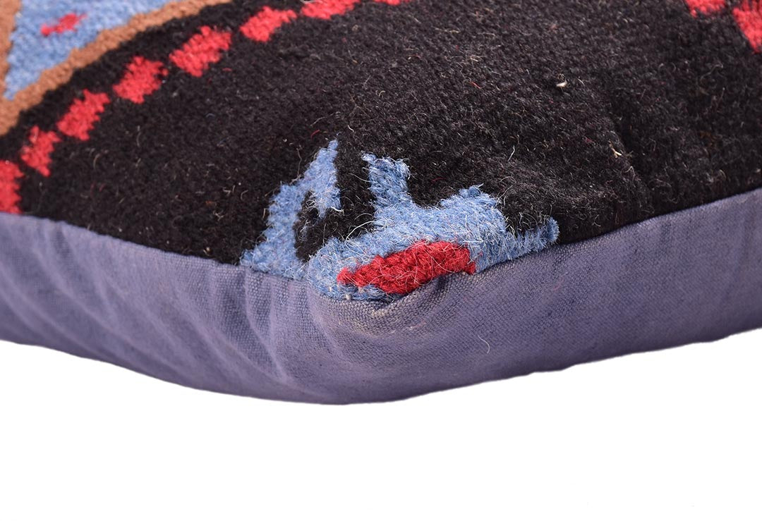 Close corner detail of the Southwestern Diamond Wool Cushion showing texture and stitching.