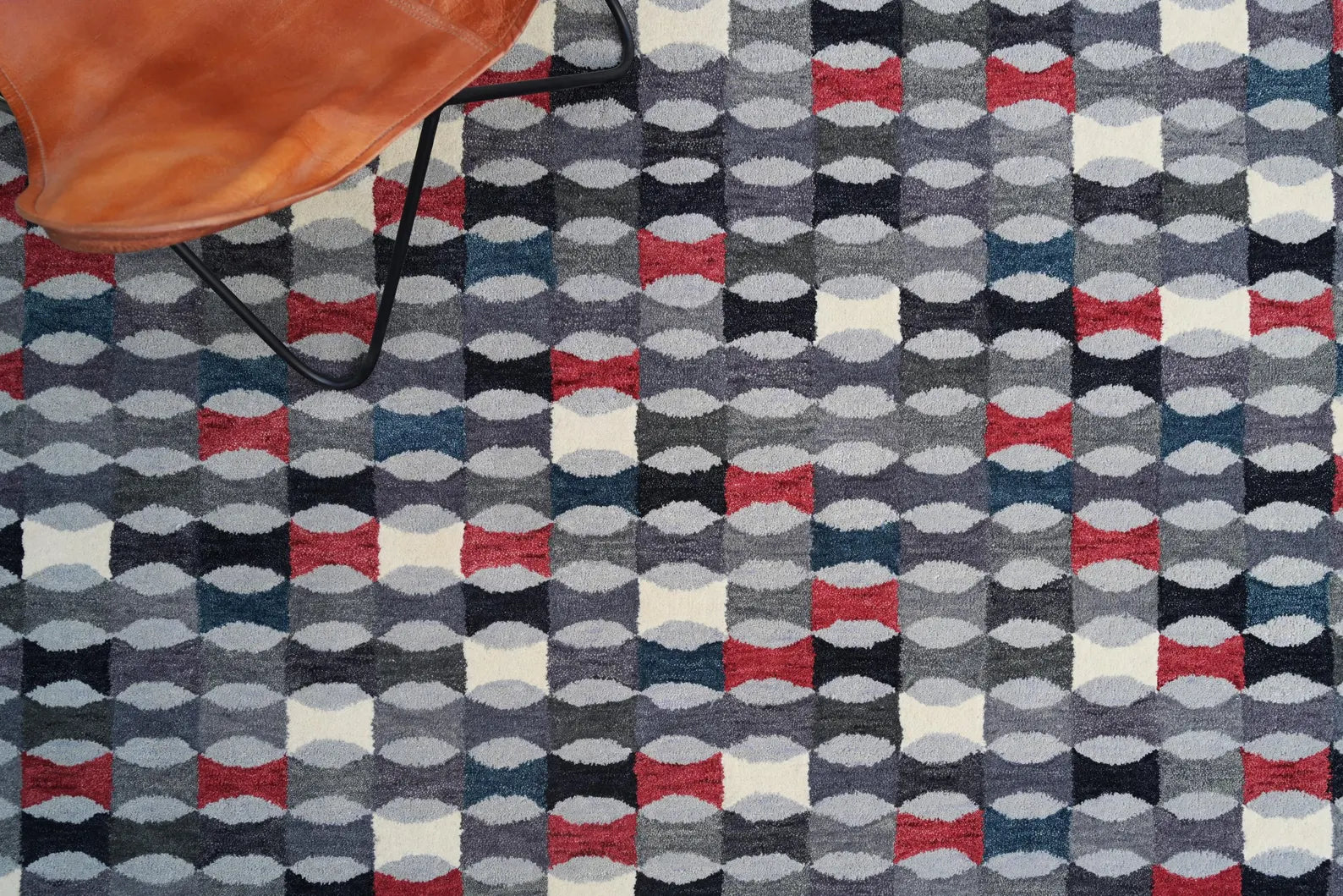 Colorful Geometric Area Rug placed with indoor plants on patio.